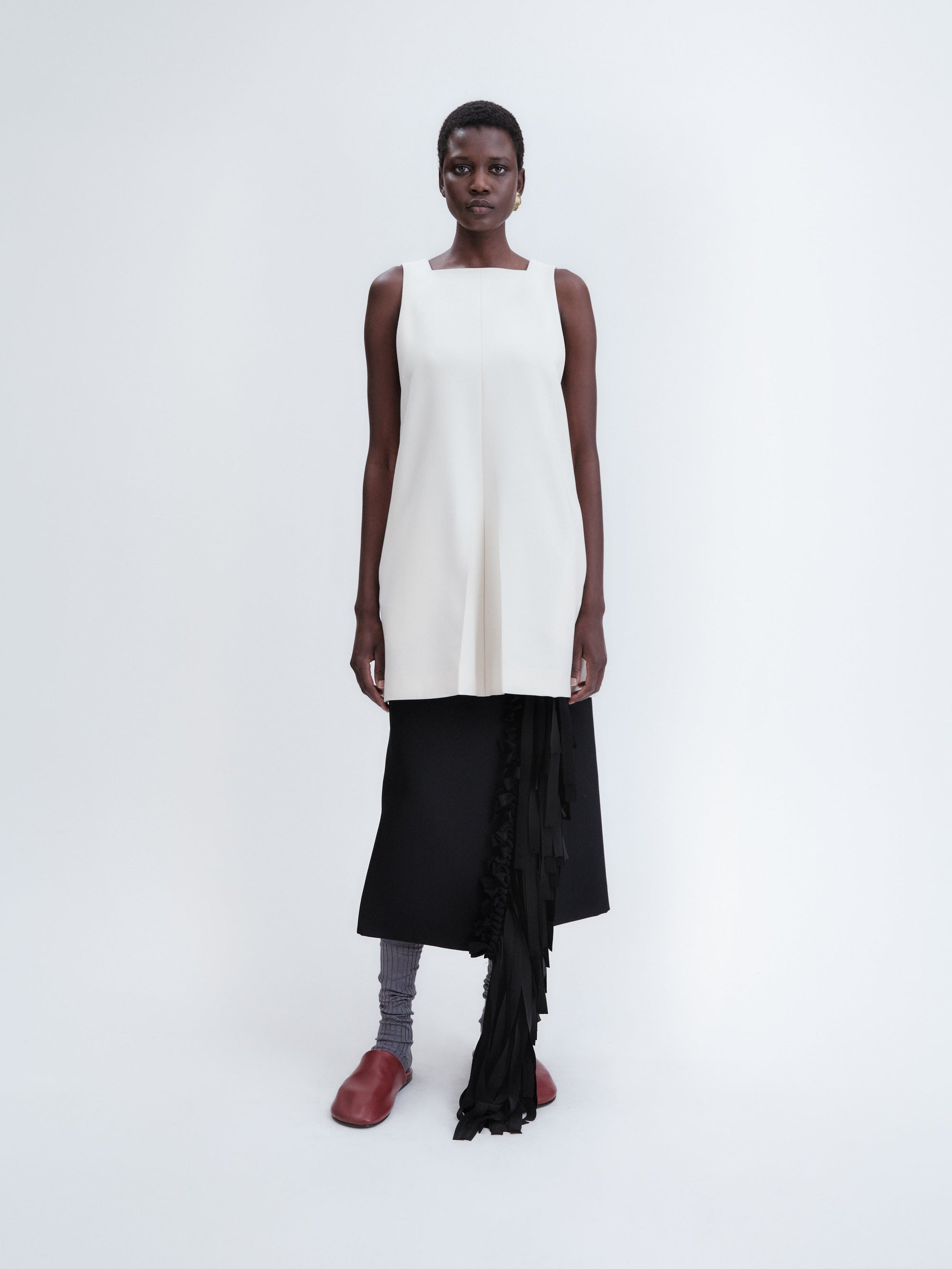 Short apron dress in crepe wool