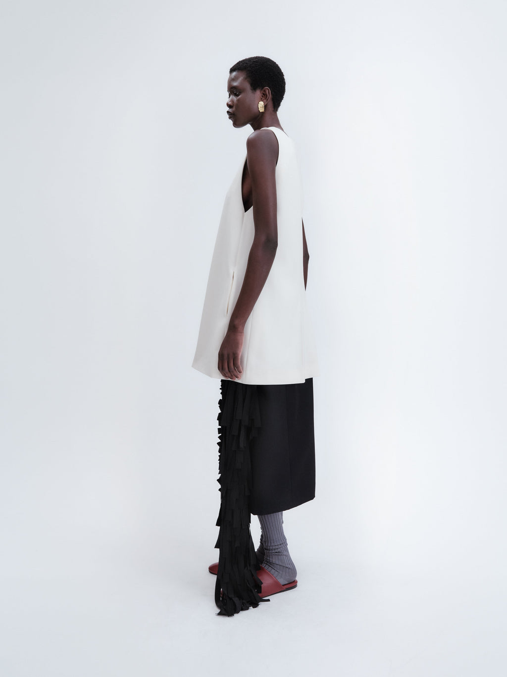 Short apron dress in crepe wool