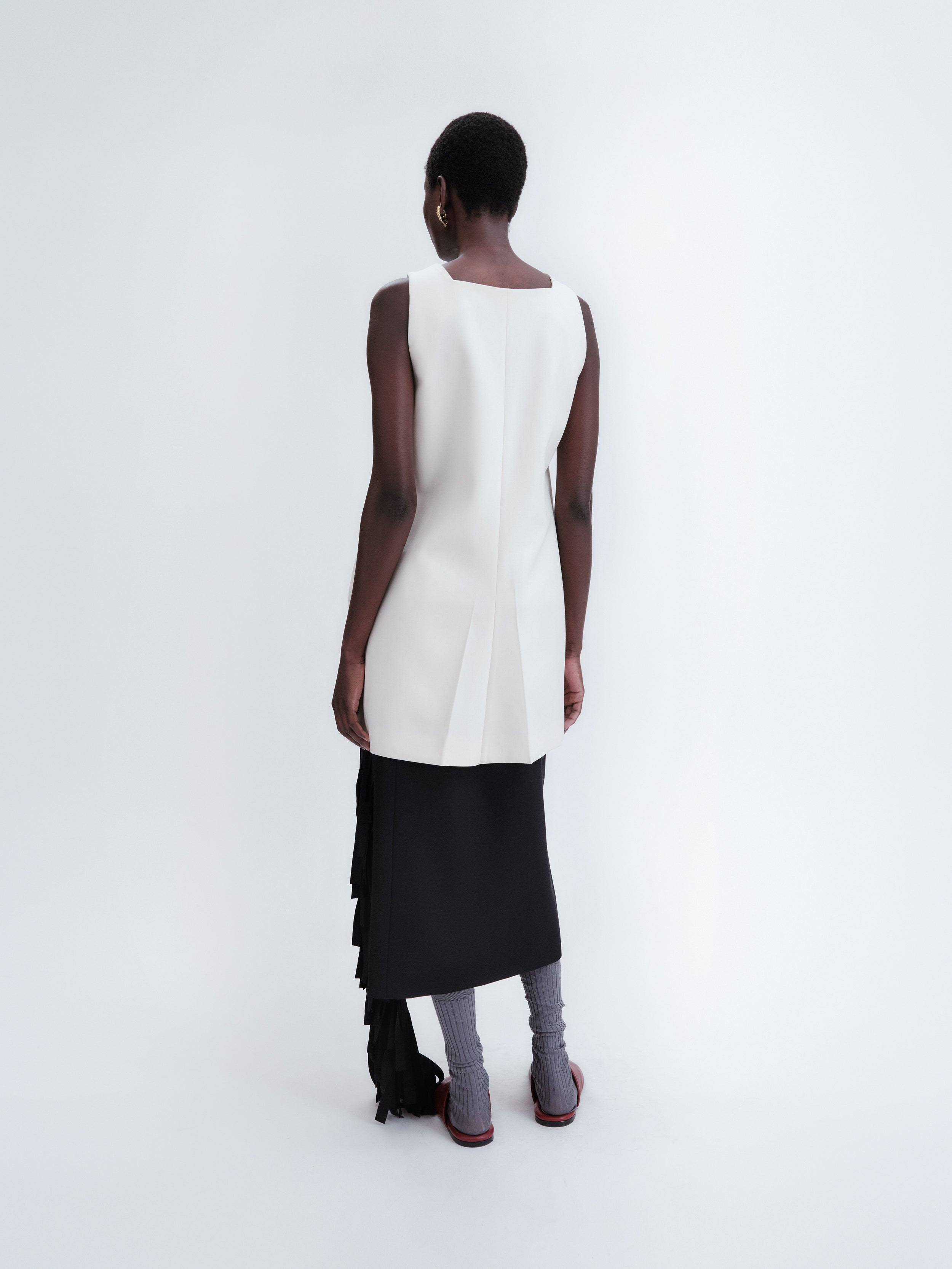 Short apron dress in crepe wool