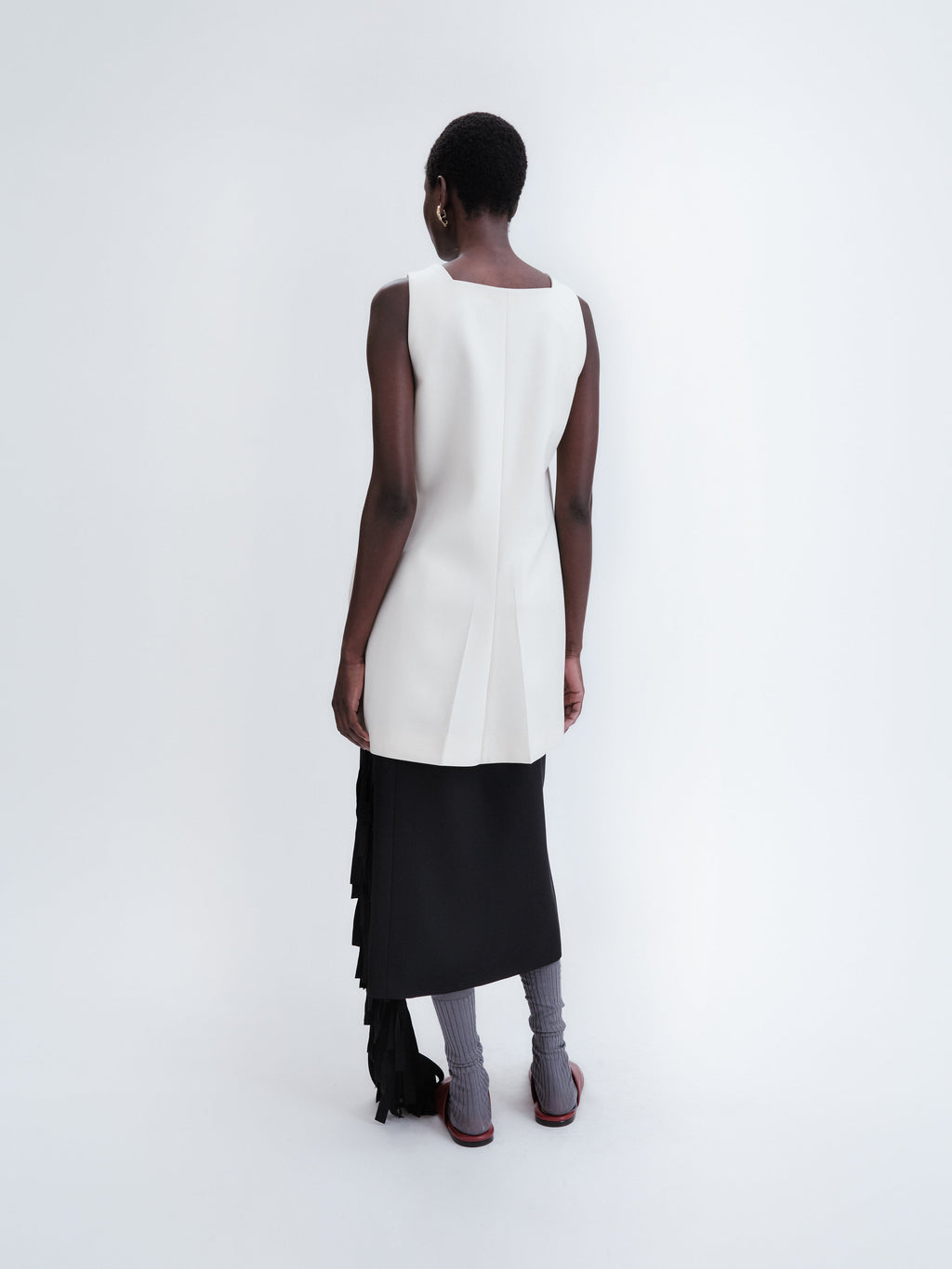 Short apron dress in crepe wool