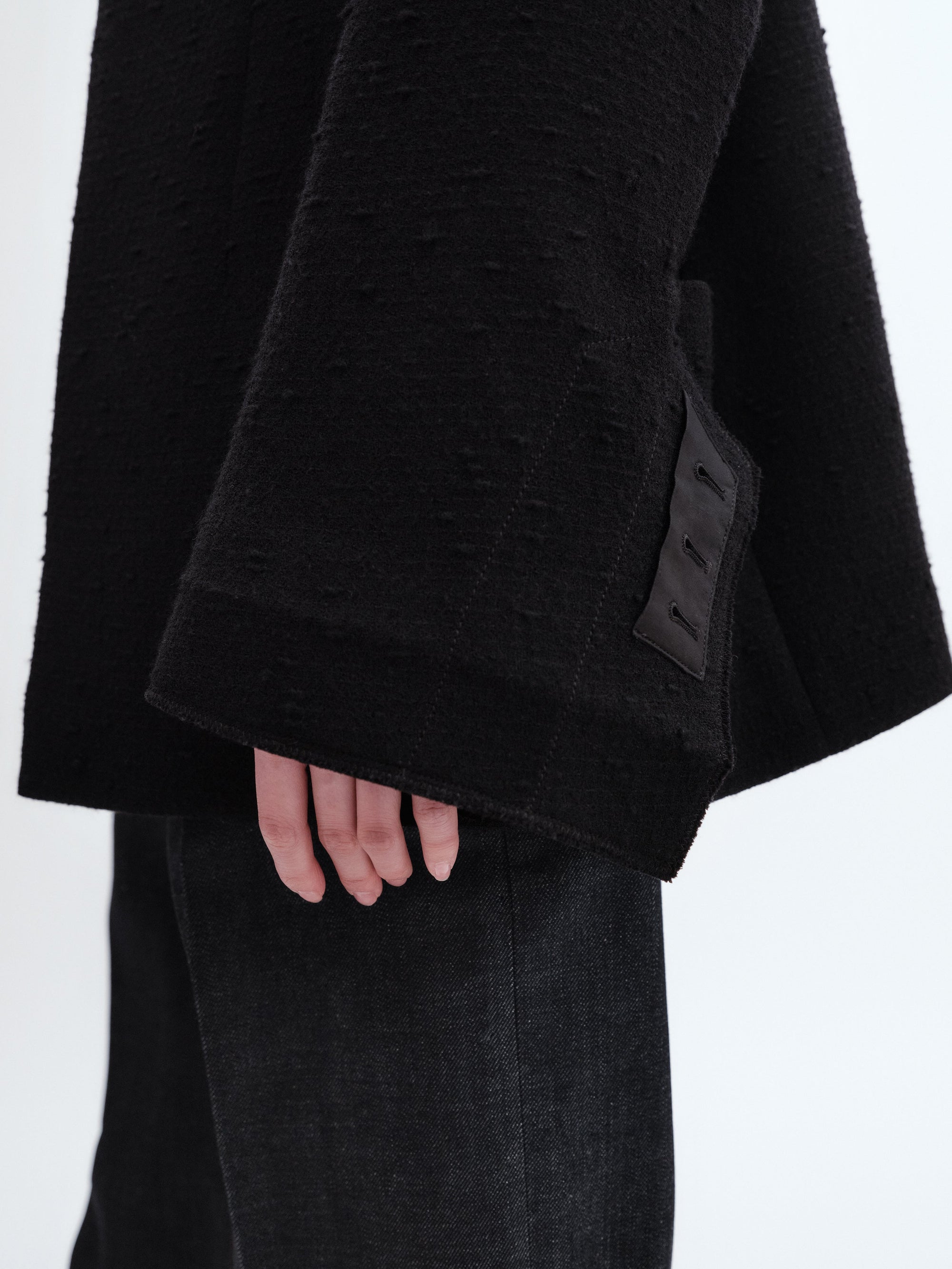 Veste déstructurée en laine bouclée