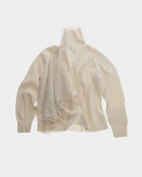 Fringed high neck jumper in fisherman rib and fringes