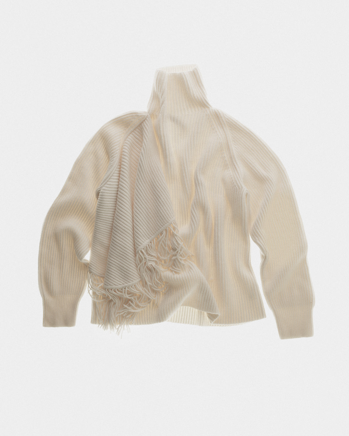 Fringed high neck jumper in fisherman rib and fringes