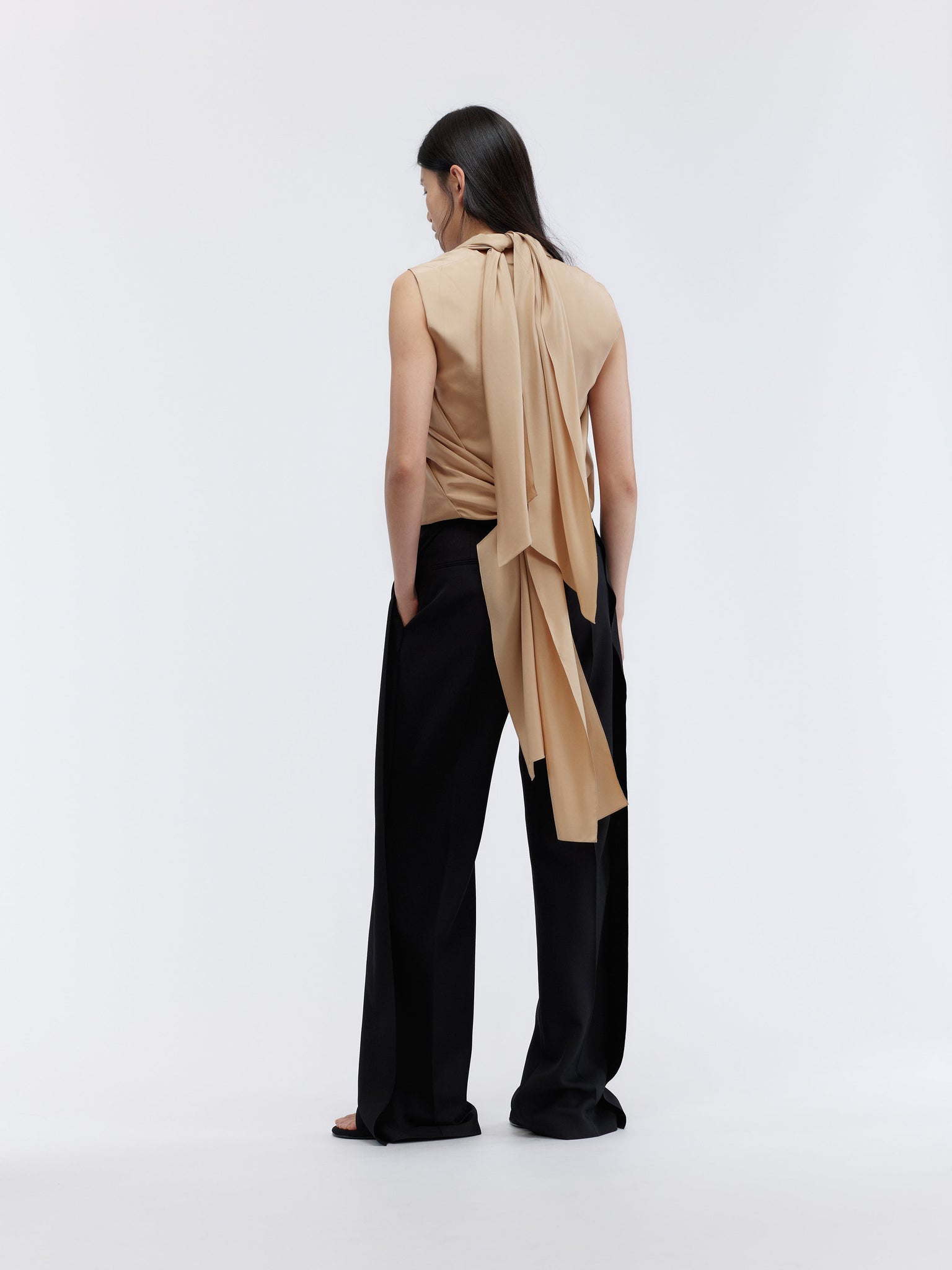 Deconstructed trousers in grain de poudre